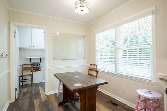 home office with dark hardwood / wood-style flooring, crown molding, and plenty of natural light