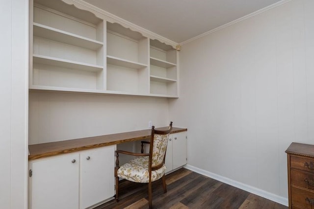 home office with crown molding, dark hardwood / wood-style flooring, and built in desk