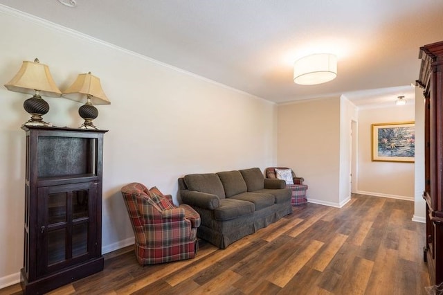 living room featuring dark hardwood / wood-style floors and crown molding