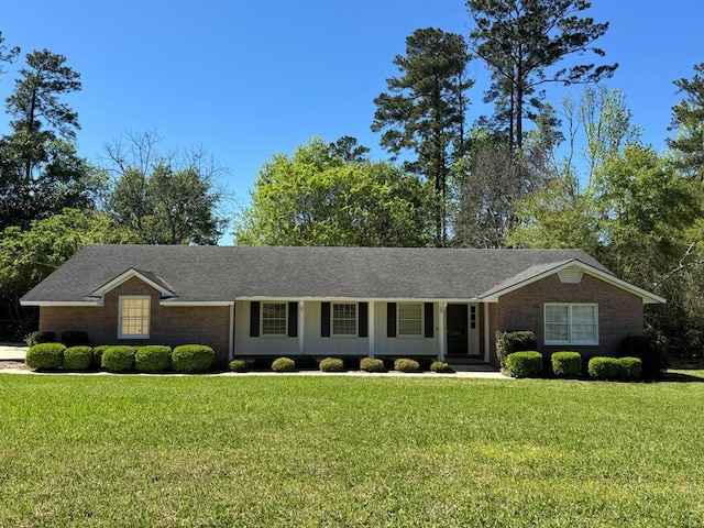 ranch-style home featuring a front yard