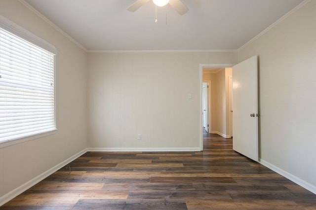 empty room with ceiling fan, dark hardwood / wood-style flooring, and ornamental molding