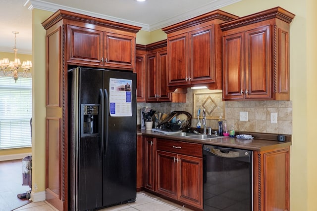 kitchen featuring a notable chandelier, light tile patterned flooring, a sink, black appliances, and dark countertops
