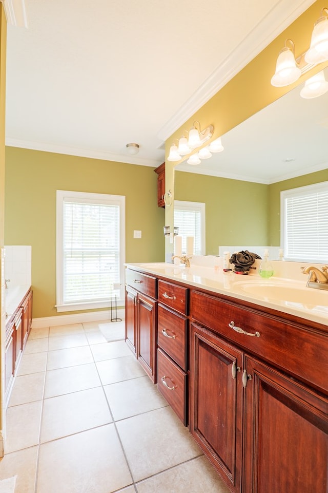 bathroom featuring ornamental molding, tile patterned floors, a sink, and plenty of natural light