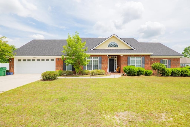 view of front facade featuring a front yard, a garage, brick siding, and driveway