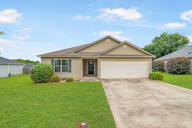 5187 Branch Point Dr, Valdosta, GA 31605 - view of front of house featuring an attached garage, concrete driveway, and a front lawn