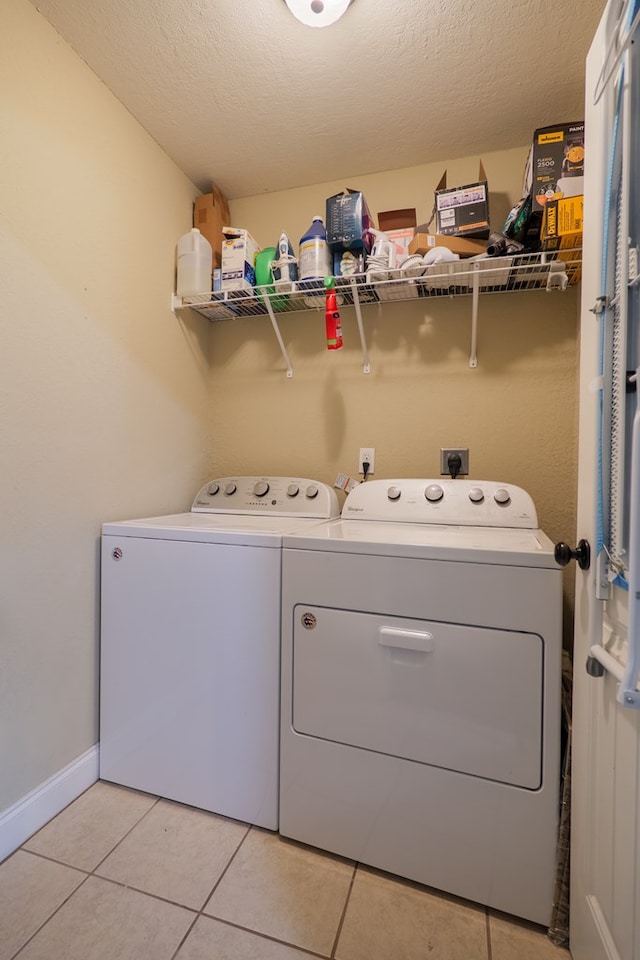 5187 Branch Point Dr, Valdosta, GA 31605 - washroom with independent washer and dryer, light tile patterned flooring, and a textured ceiling