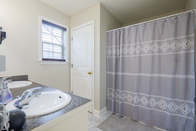 5187 Branch Point Dr, Valdosta, GA 31605 - full bath with marble look tile flooring, double vanity, and a shower with curtain