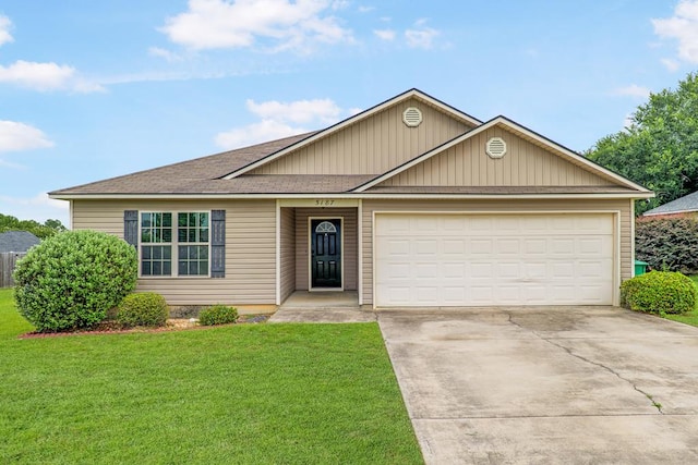5187 Branch Point Dr, Valdosta, GA 31605 - view of front of property featuring concrete driveway, a front yard, a garage, and a shingled roof