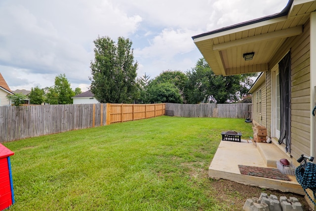 5187 Branch Point Dr, Valdosta, GA 31605 - fenced backyard with a patio area and an outdoor fire pit