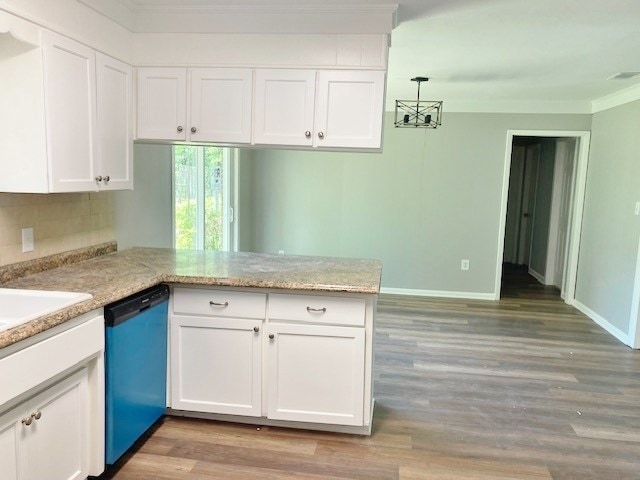 619 Lakeview Dr, Adel, GA 31620 - kitchen with dishwasher, a peninsula, white cabinetry, decorative backsplash, and light wood finished floors