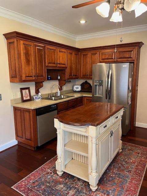 kitchen with stainless steel appliances, a sink, dark wood finished floors, ceiling fan, and open shelves