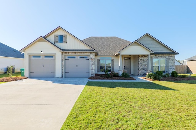 craftsman-style house with a front yard and a garage