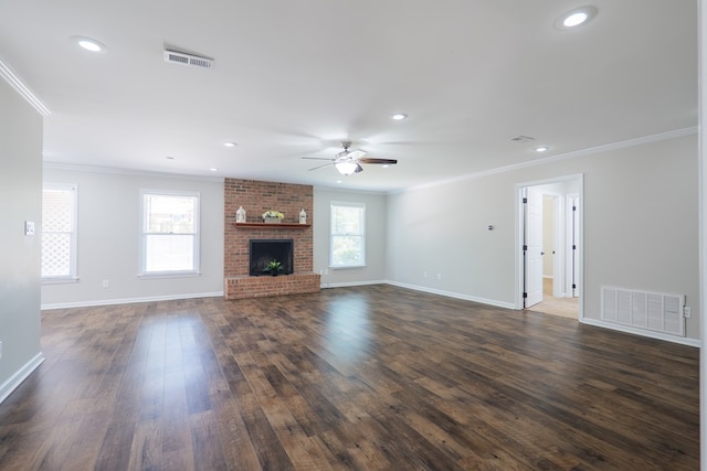unfurnished living room with ceiling fan, visible vents, and ornamental molding