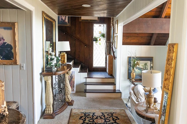 foyer with wood walls and wooden ceiling