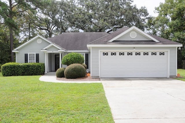 ranch-style house with a garage and a front yard