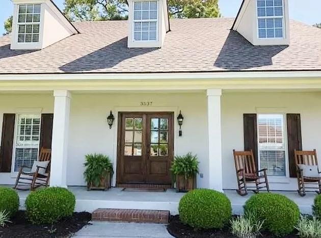 doorway to property with french doors and covered porch