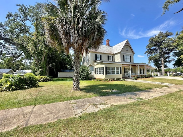 view of front of house with a front lawn and a porch