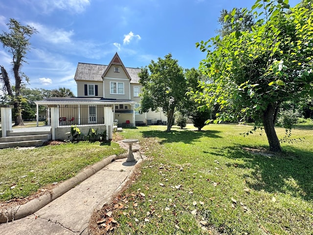 view of front of property with covered porch and a front lawn