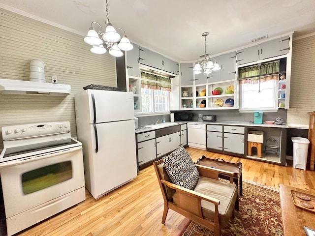 kitchen featuring a notable chandelier, decorative backsplash, pendant lighting, and white appliances