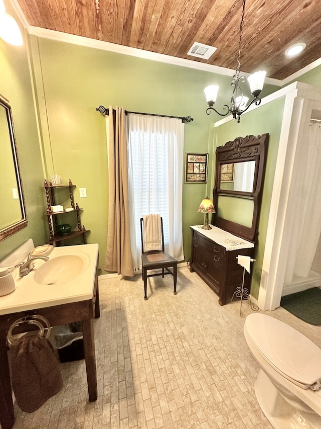 bathroom featuring toilet, vanity, a chandelier, and wooden ceiling