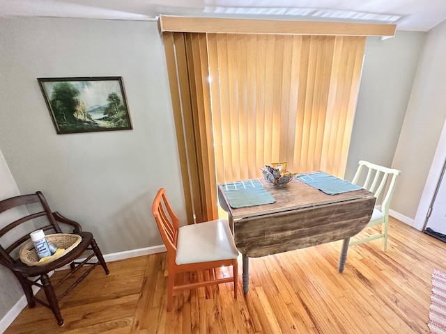 dining area featuring wood-type flooring