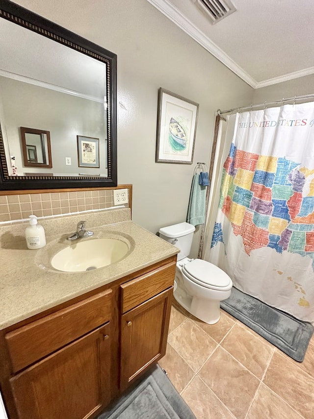 bathroom with toilet, tasteful backsplash, tile patterned flooring, crown molding, and vanity