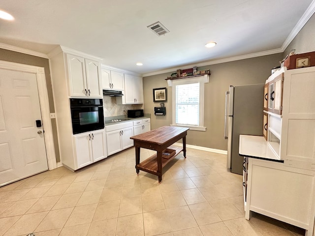 kitchen with light tile patterned floors, white cabinetry, backsplash, crown molding, and black appliances