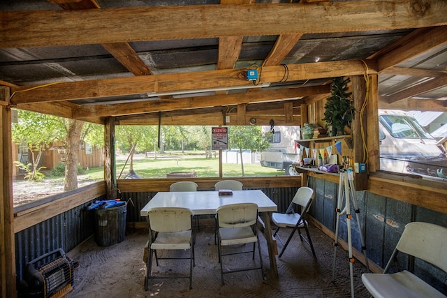 sunroom / solarium featuring vaulted ceiling