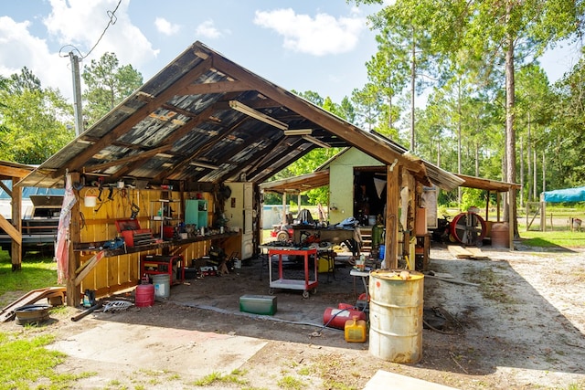 view of patio / terrace with an outbuilding