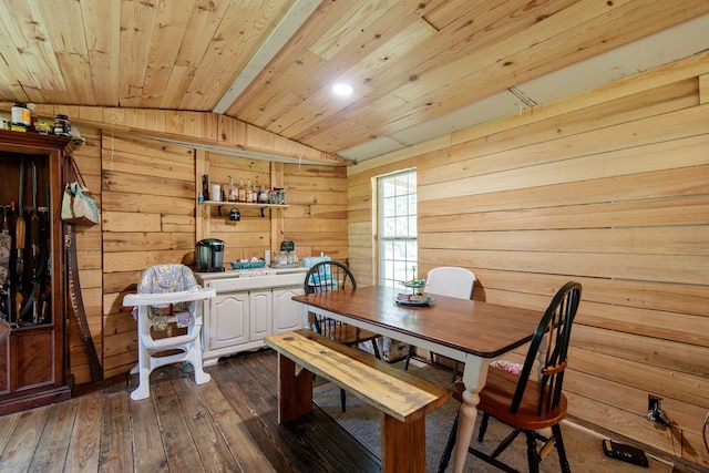 dining room with wooden walls, dark hardwood / wood-style flooring, wood ceiling, and lofted ceiling