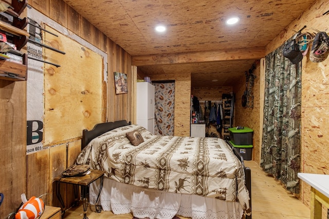 bedroom with wooden walls