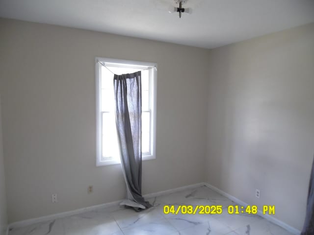 6 Prince Cv, Valdosta, GA 31601 - spare room featuring marble finish floor and baseboards