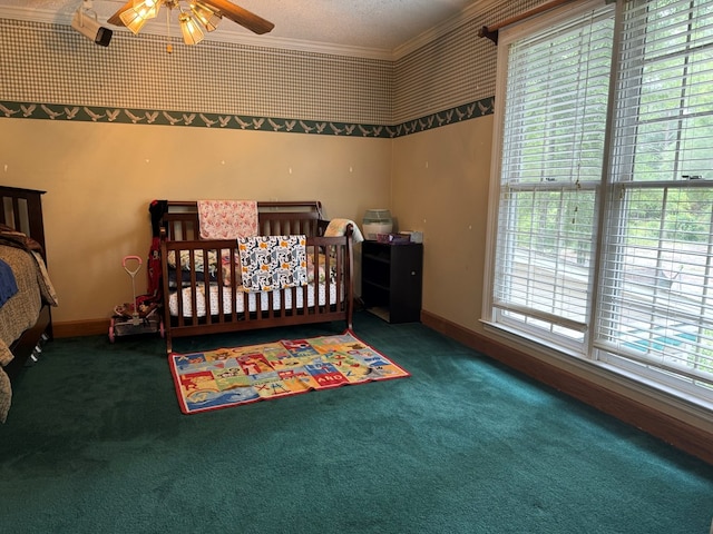 bedroom with dark carpet, ceiling fan, and ornamental molding