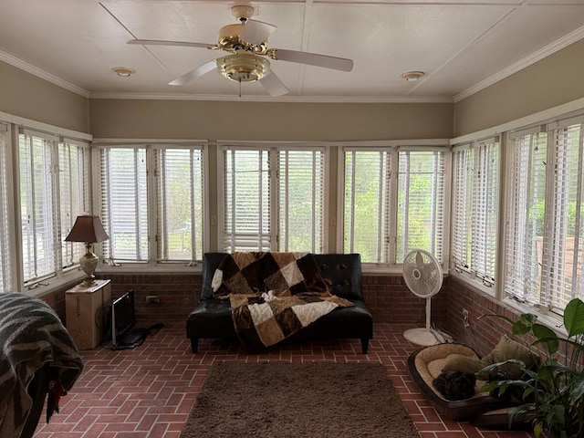 sunroom featuring ceiling fan