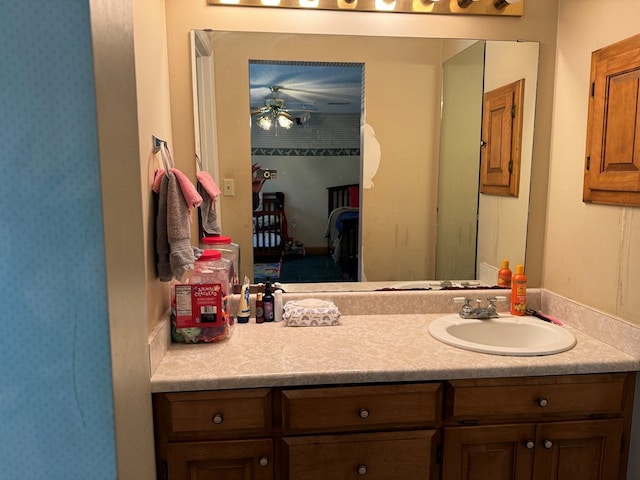 bathroom featuring ceiling fan and vanity