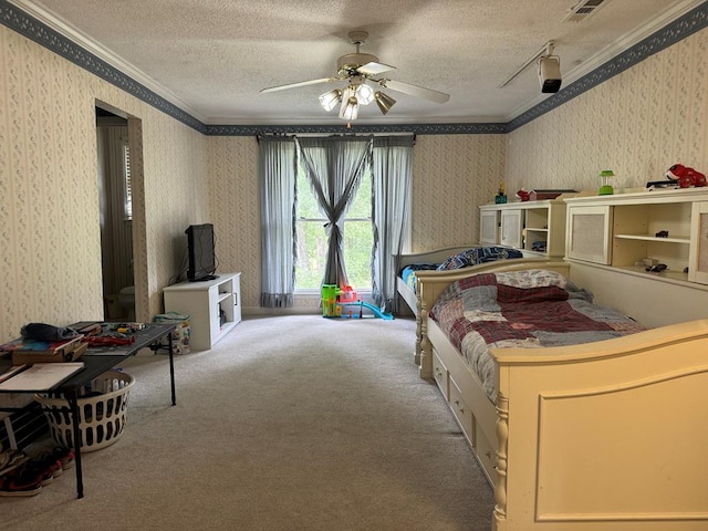 bedroom featuring carpet flooring, ceiling fan, a textured ceiling, and ornamental molding