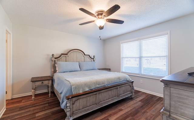 bedroom featuring a textured ceiling, ceiling fan, and dark hardwood / wood-style floors