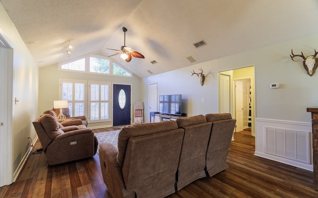 living room featuring a textured ceiling, ceiling fan, dark hardwood / wood-style flooring, and lofted ceiling