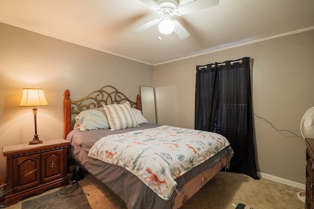 carpeted bedroom featuring ceiling fan and crown molding