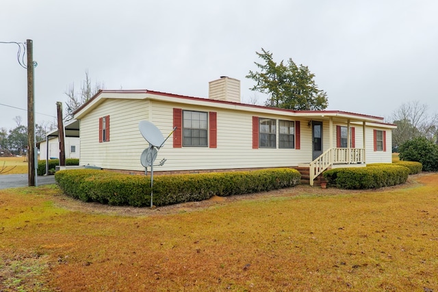 view of front of home with a front yard