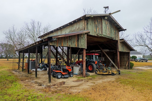 view of outbuilding with a yard