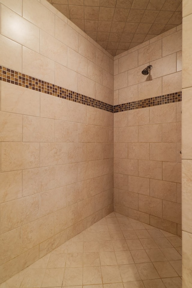 bathroom with tiled shower