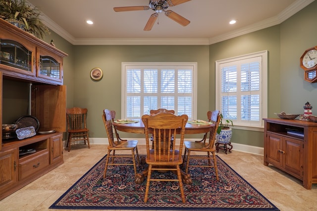 dining room with ornamental molding and ceiling fan