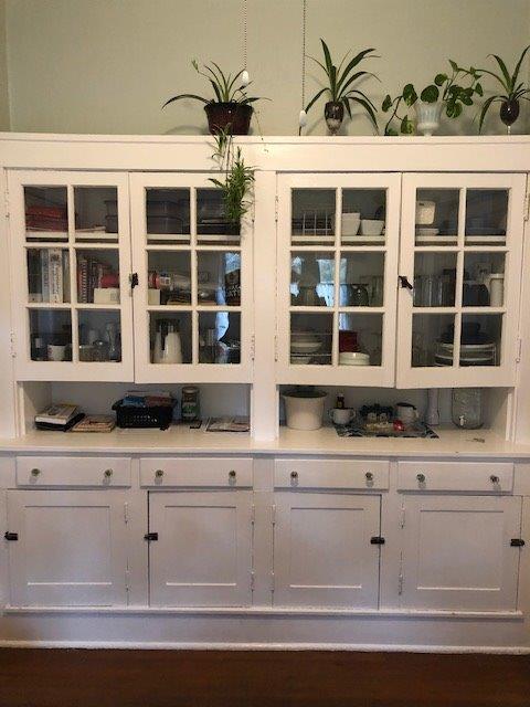 bar featuring white cabinets