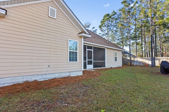 view of home's exterior with a lawn