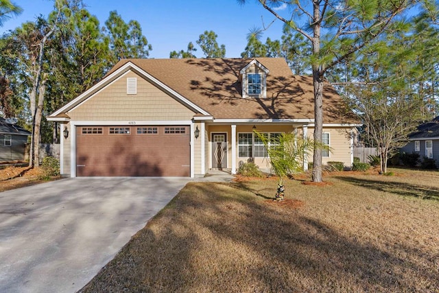 view of front facade with a front yard and a garage