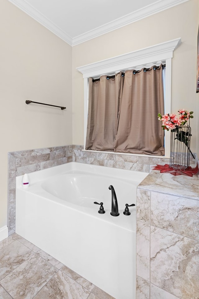 bathroom with a bathing tub and crown molding