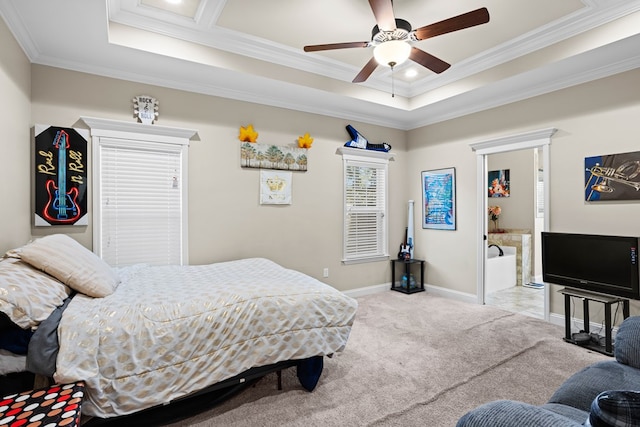 bedroom featuring ceiling fan, crown molding, light carpet, and a tray ceiling