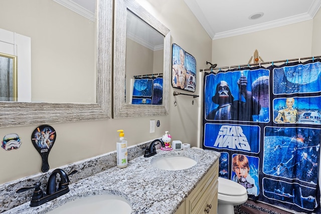 bathroom with vanity, toilet, ornamental molding, and walk in shower