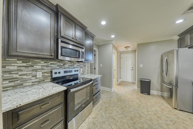 kitchen with crown molding, appliances with stainless steel finishes, dark brown cabinets, and backsplash